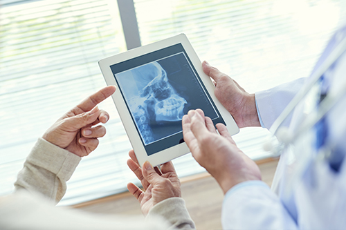 A consultation about Invisalign treatment at our Commack office